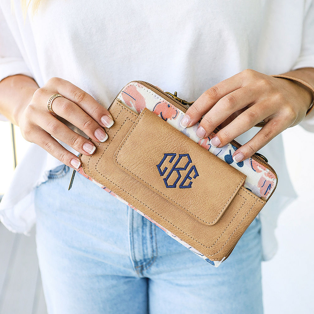 https://images.marleylilly.com/catalog/homepage/548/flash-sale-ad-close-up-of-girl-holding-navy-bouquet-phone-wristlet.jpg