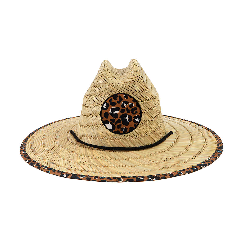 pink fiesta straw hat on beach