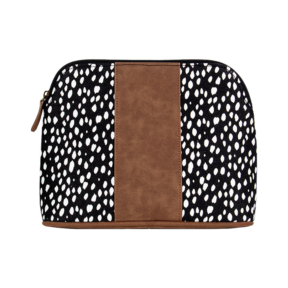 black dot collection in car with train case