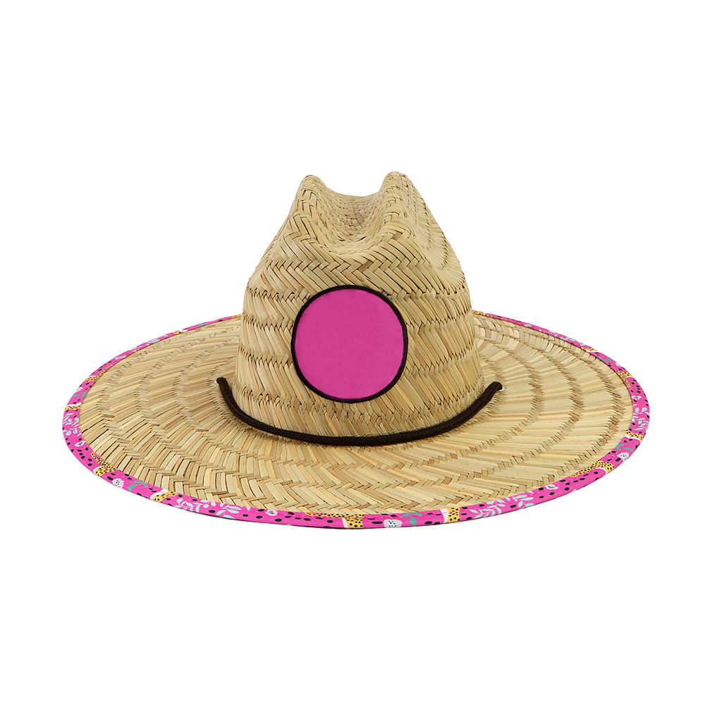 pink fiesta straw hat on beach