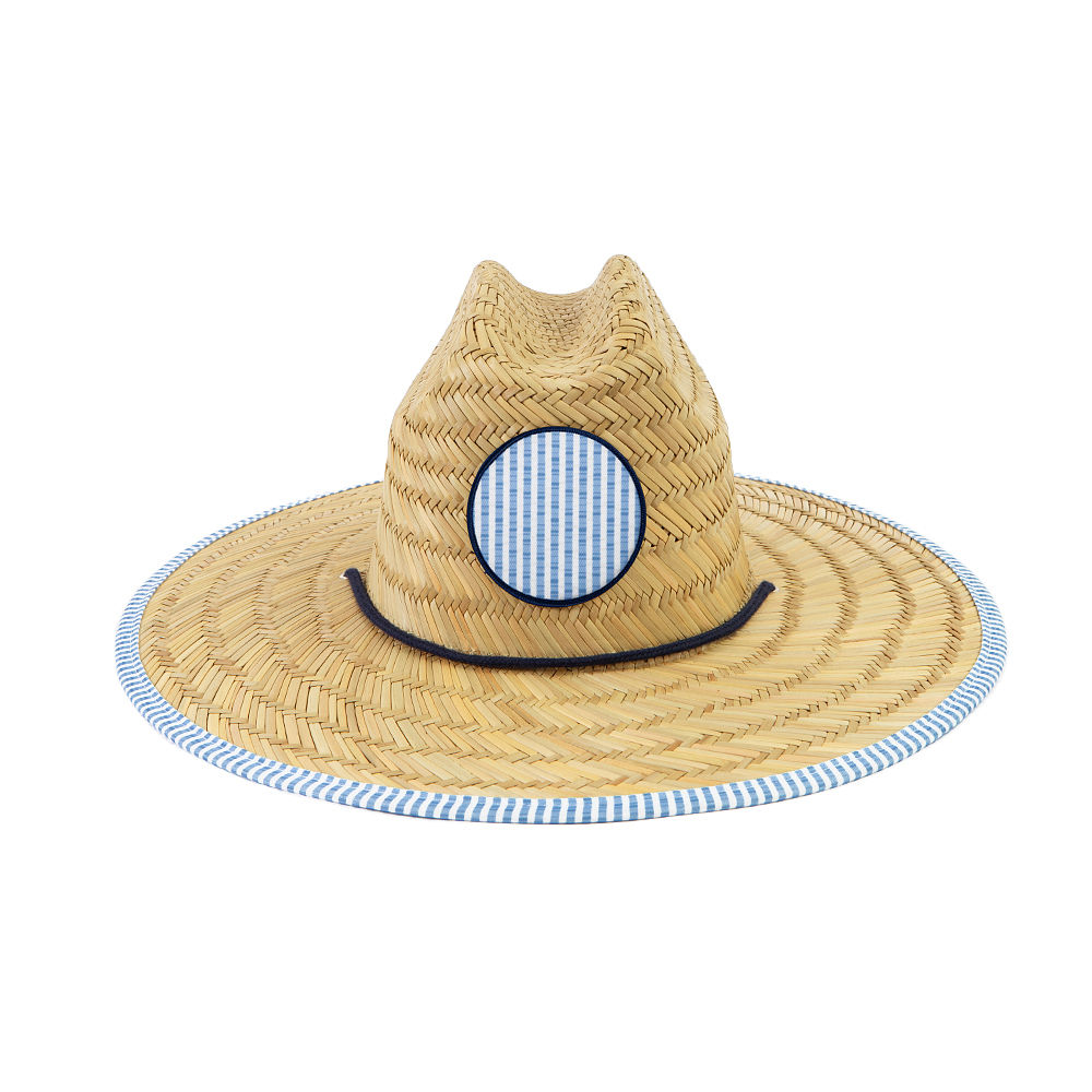 pink fiesta straw hat on beach