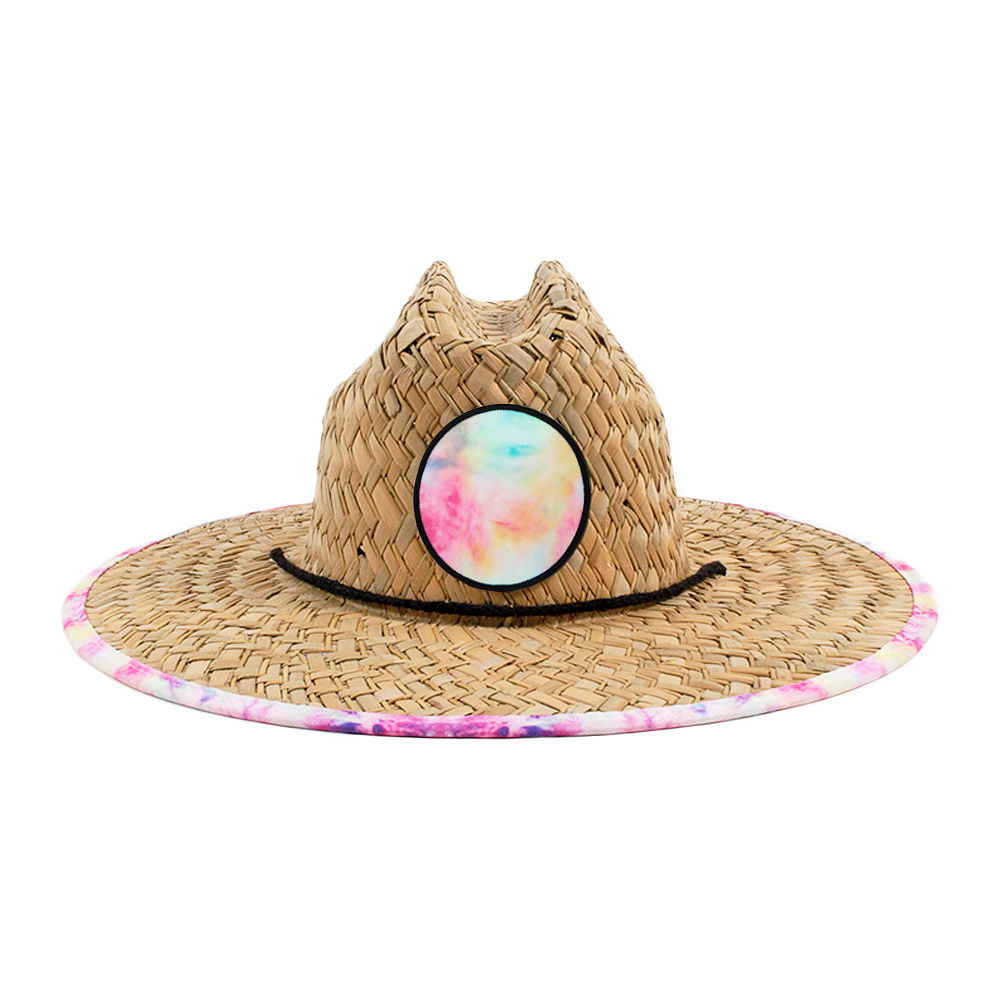 pink fiesta straw hat on beach