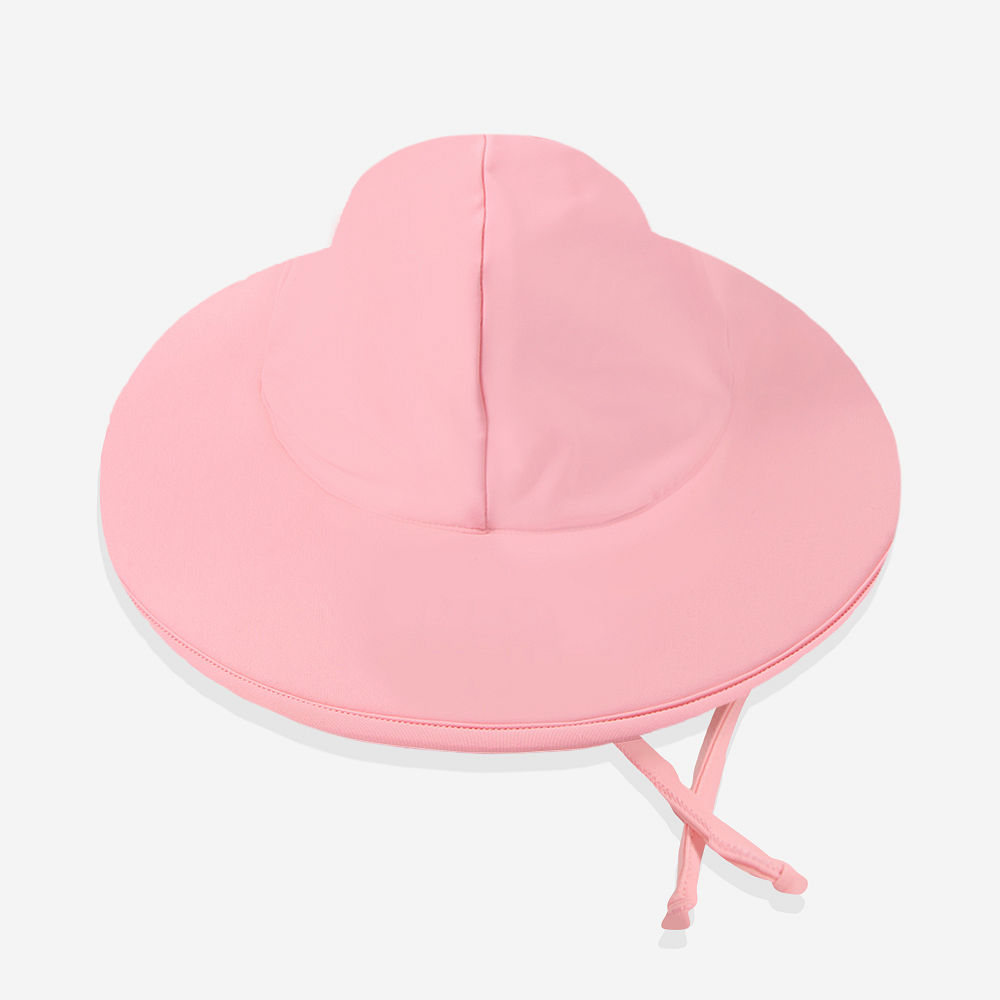 baby girl with pink sun hat and sunglasses