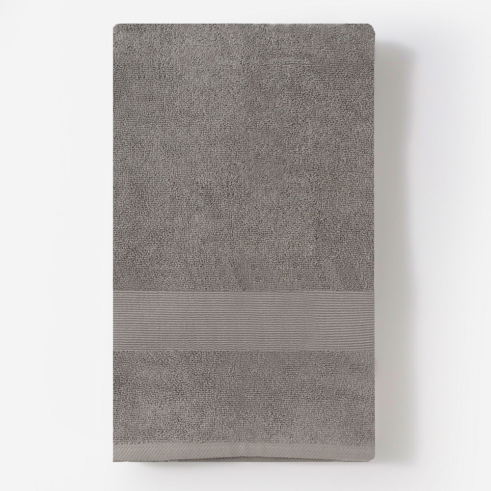 monogrammed bath towel in white hanging