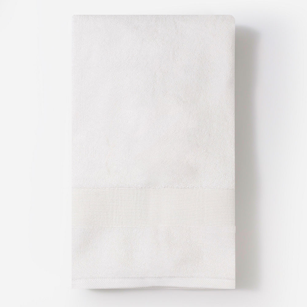 monogrammed bath towel in white hanging