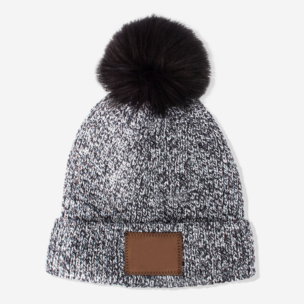 brunette wearing matching charcoal knit beanie and gloves