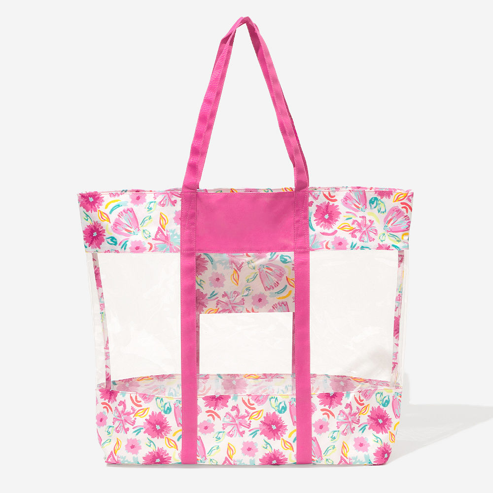 girl wearing blue shells clear beach tote on shoulder