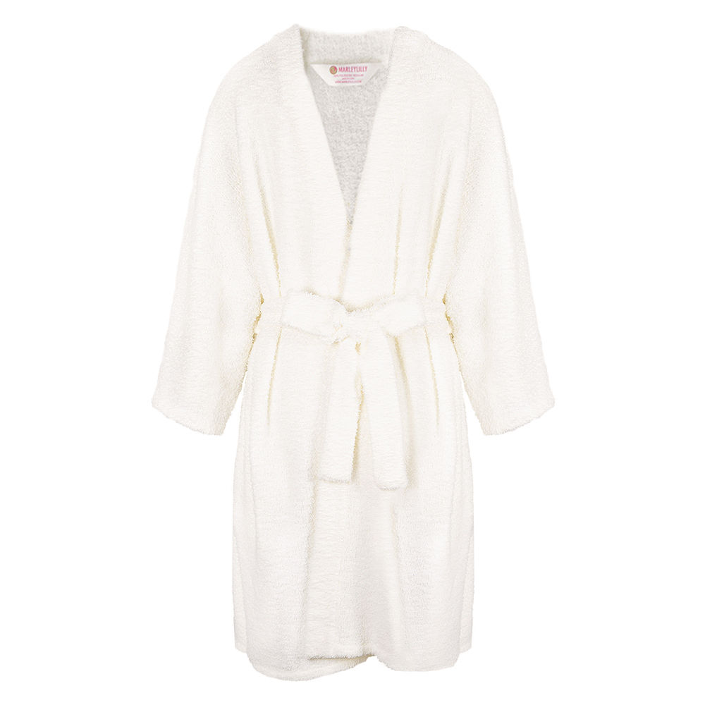model sitting wearing monogrammed cozy robe