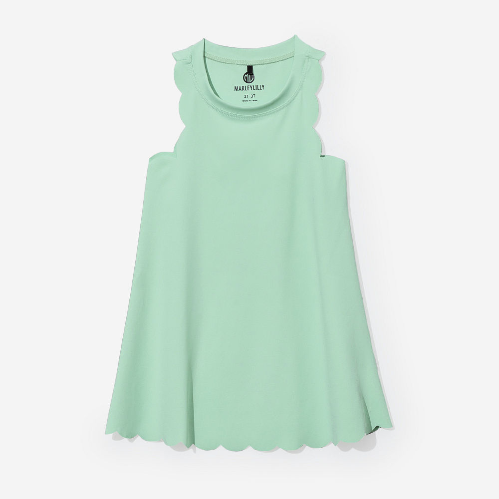 girl wearing kids scallop monogrammed lavender dress