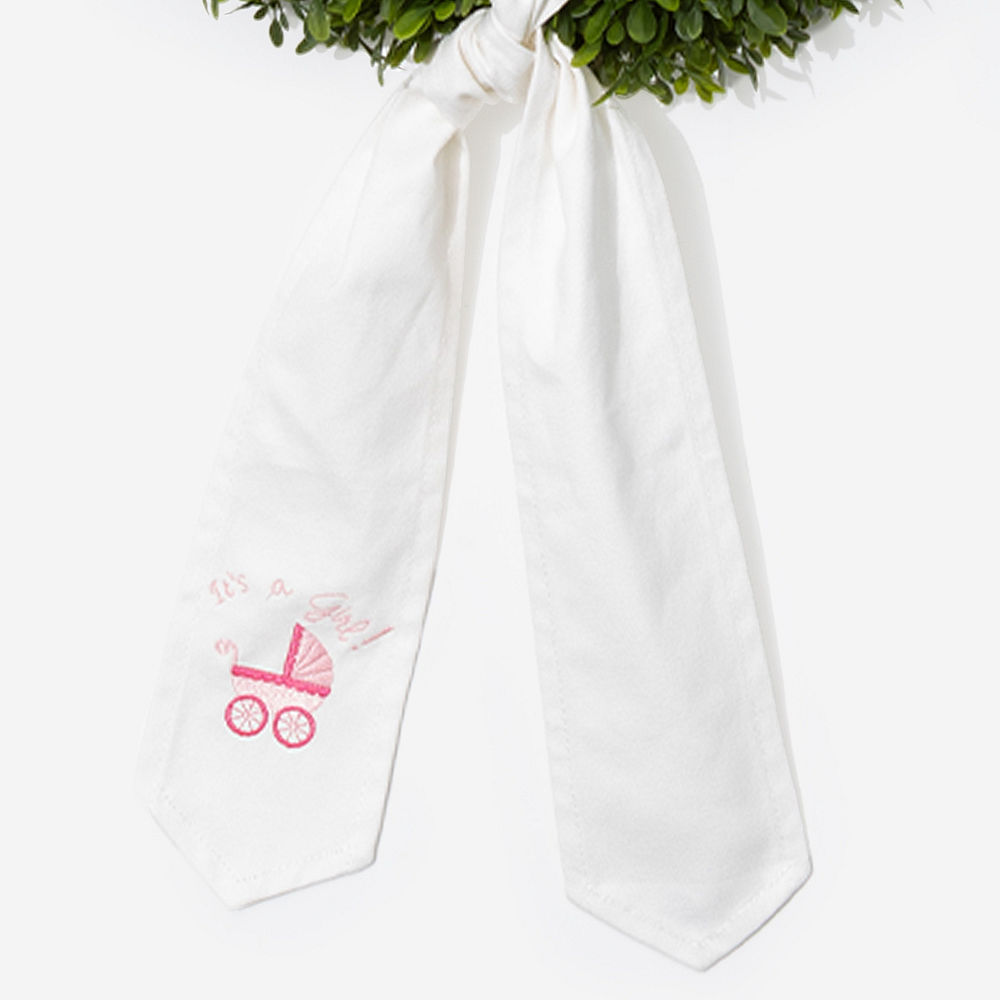 girl new baby wreath sash on pink background