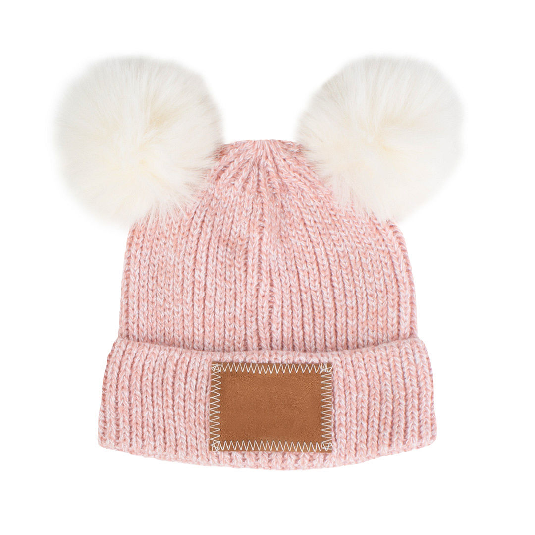 pink pom pom beanie on little girl