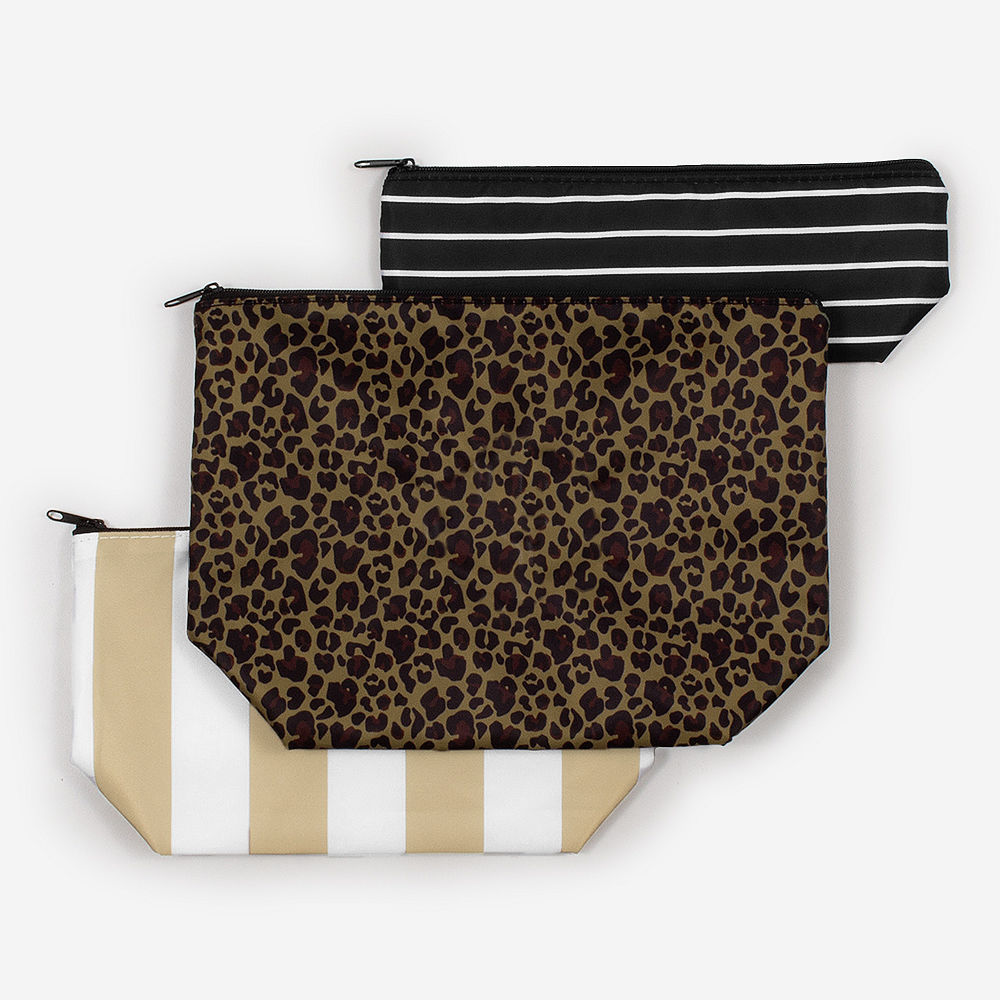 monogrammed packable cosmetic bag in Leopard with hair supplies