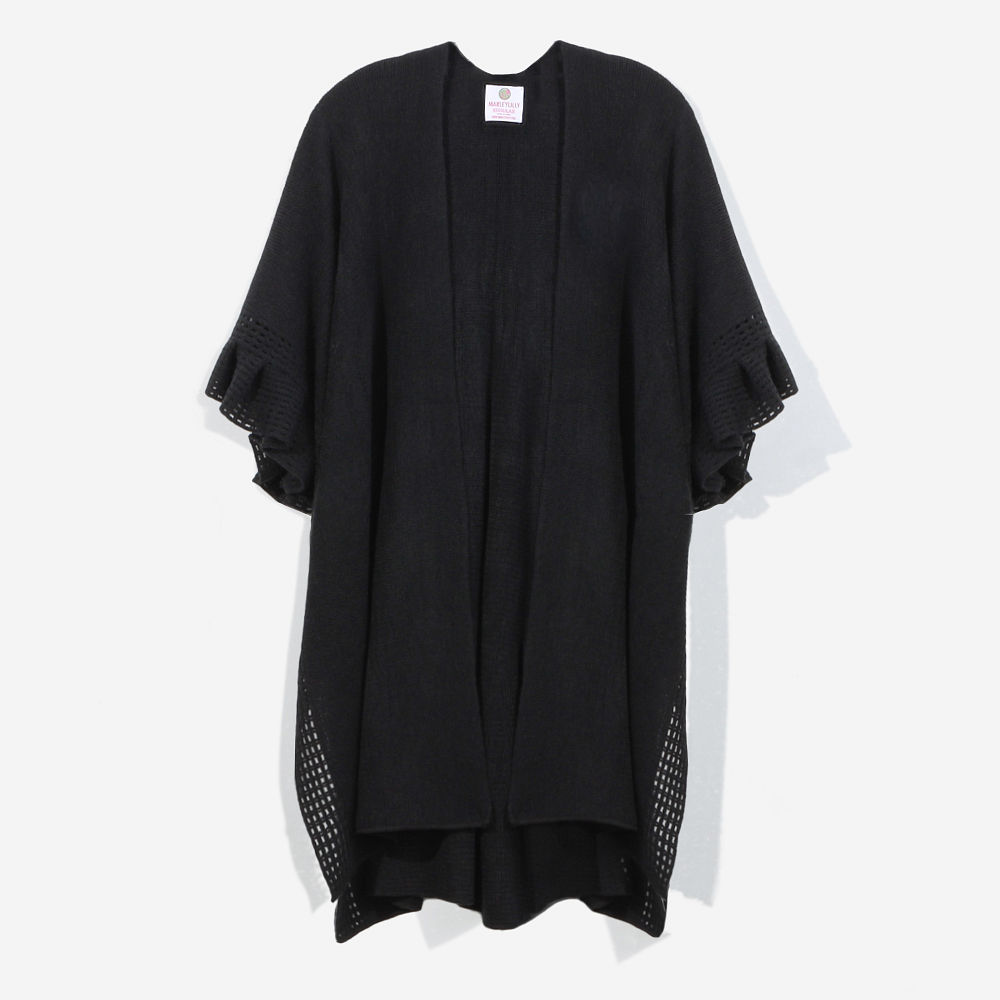 black monogrammed poncho cardigan front with denim