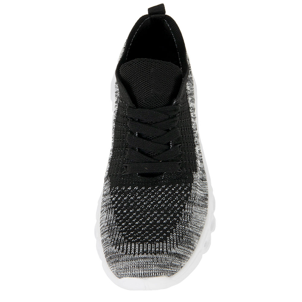 black scallop sneakers on asphalt