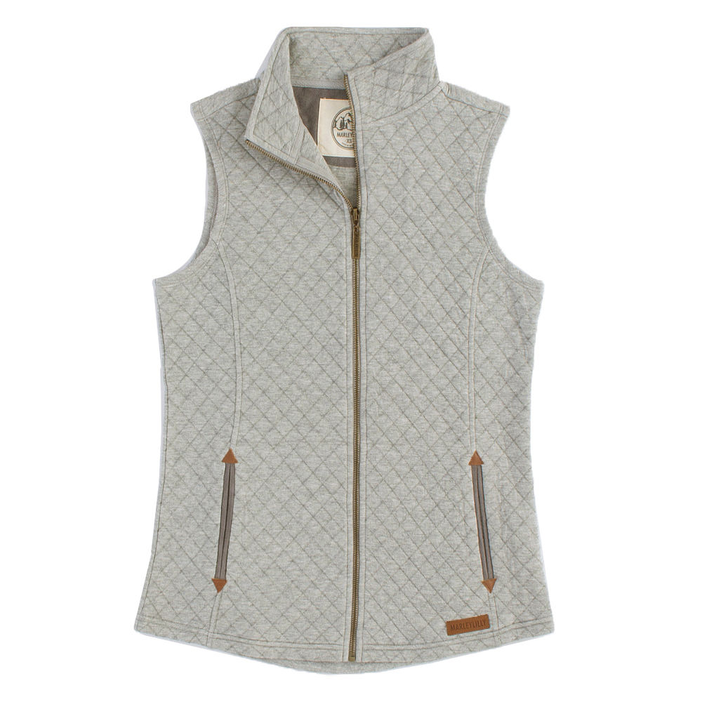 black monogrammed quilted vest with gray layering tee and duck boots