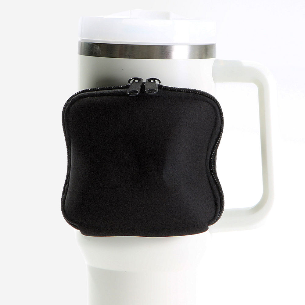 black water bottle belt bag on pink travel tumbler