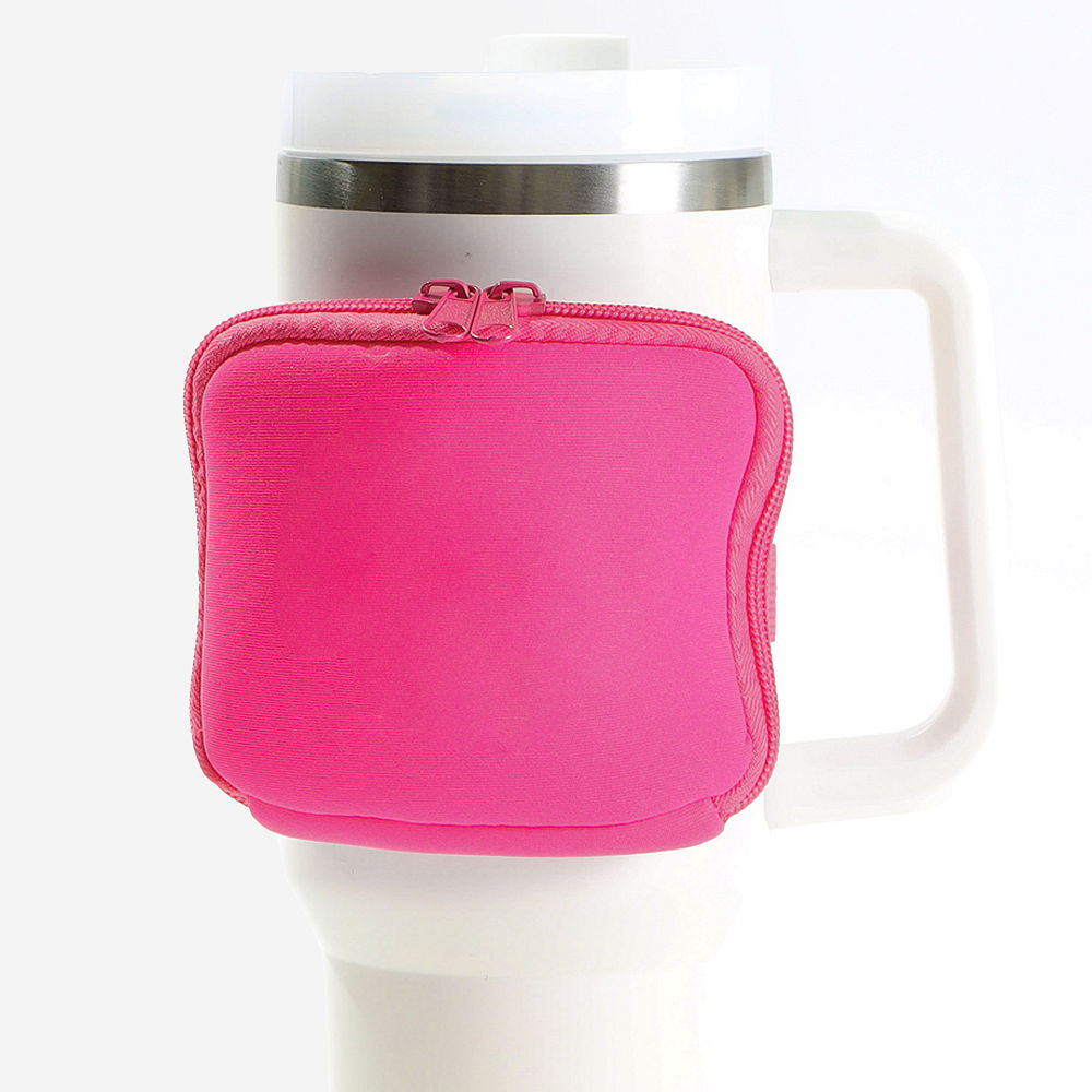 black water bottle belt bag on pink travel tumbler
