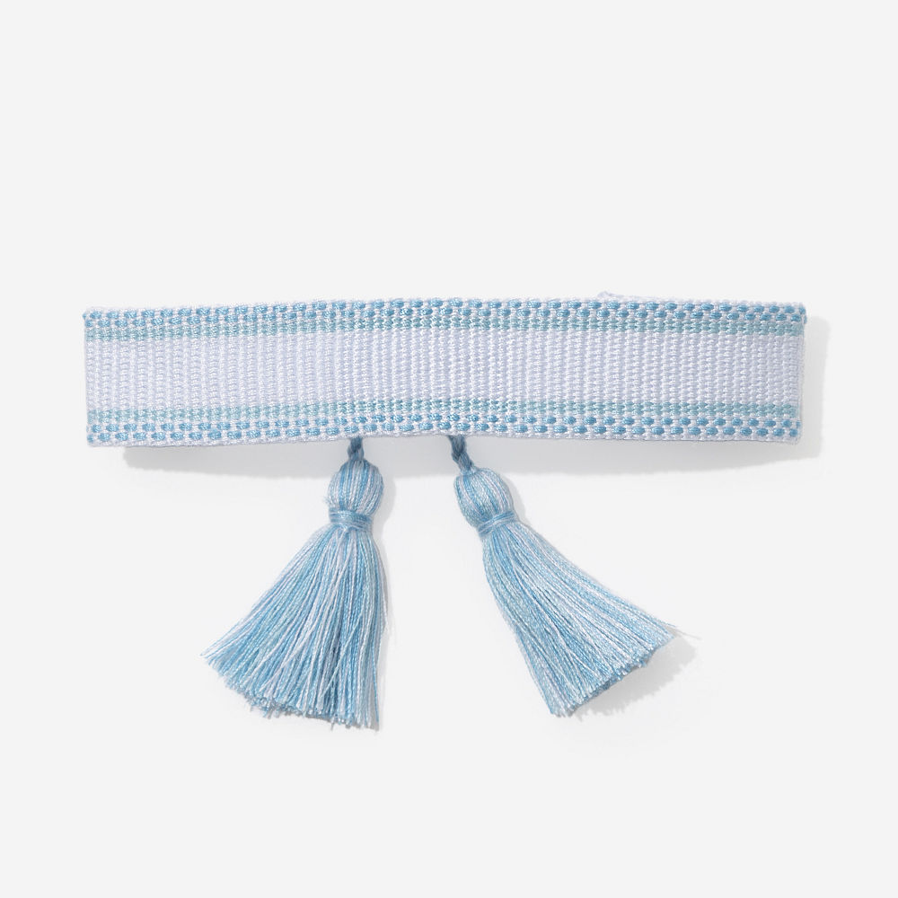 blue personalized woven bracelet on wrist close up