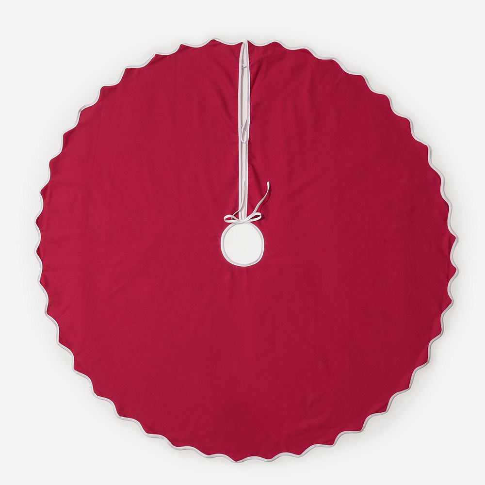 red tree skirt on green background