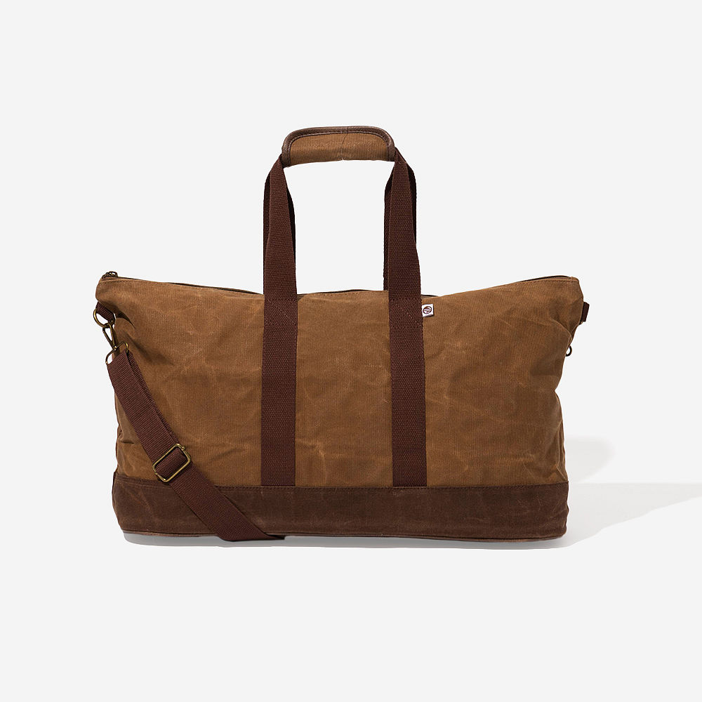 kids waxed canvas weekender on shoulder