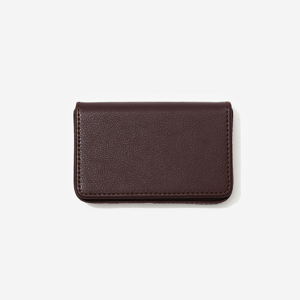 brown business card holder with notebook