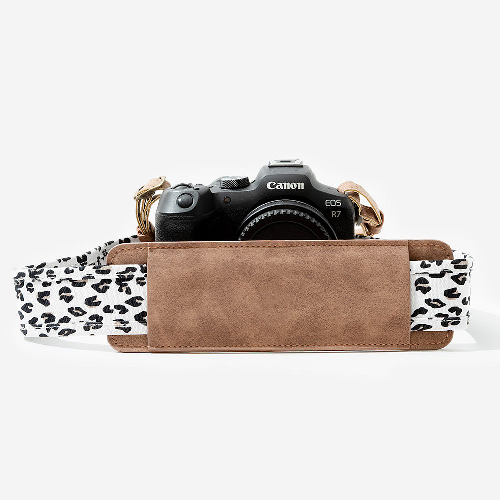 leopard camera strap flatlay - 2025