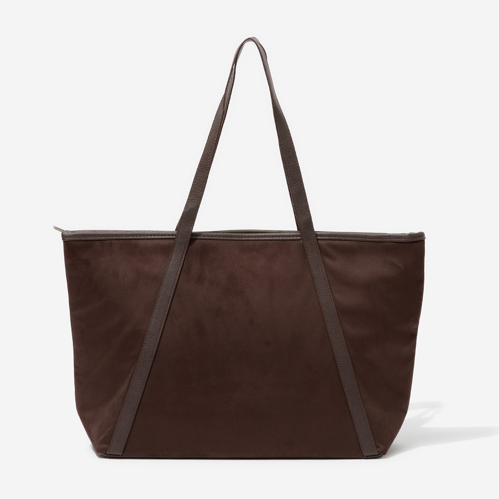 brown suede tote on shoulder