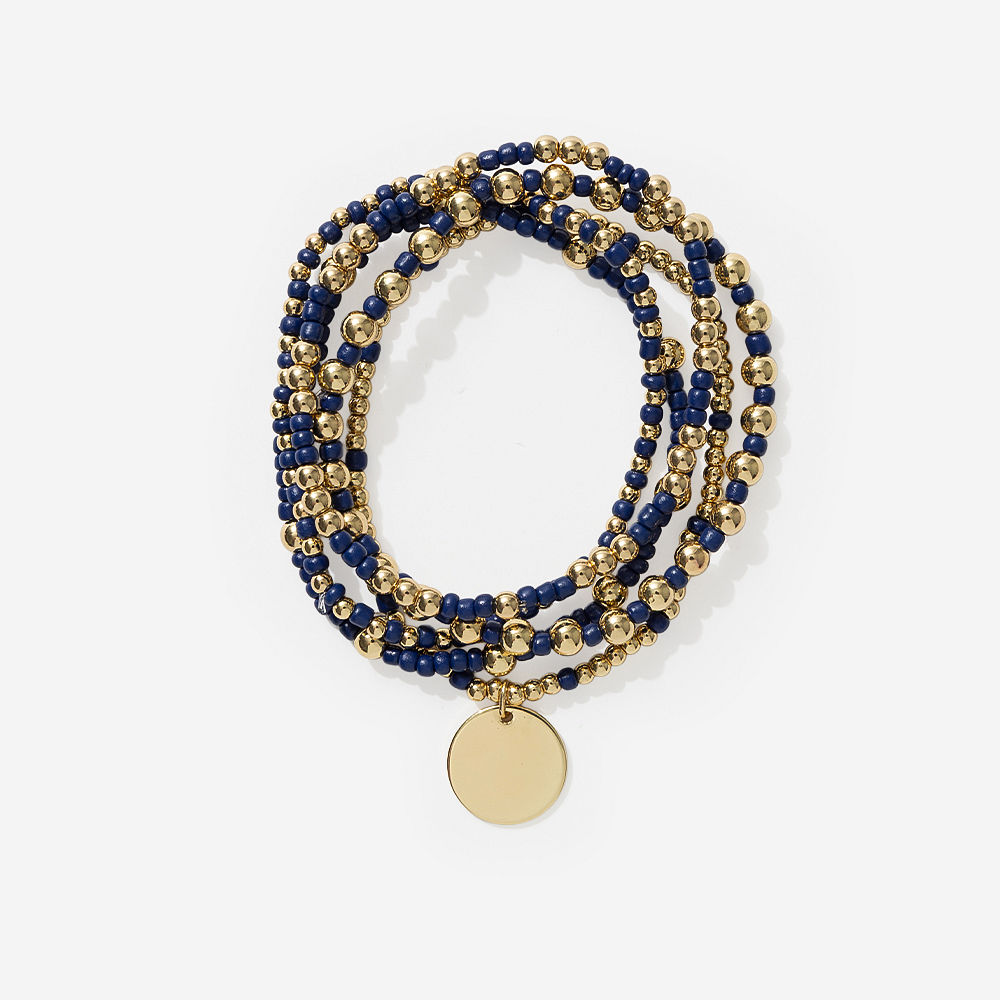 pearl gameday bracelet stack on sage background