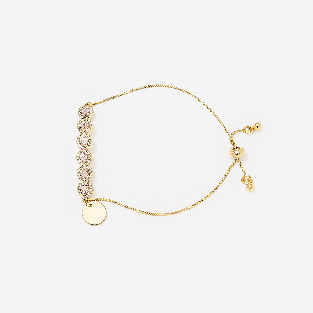 monogrammed rhinestone heart bracelet and earrings on pink