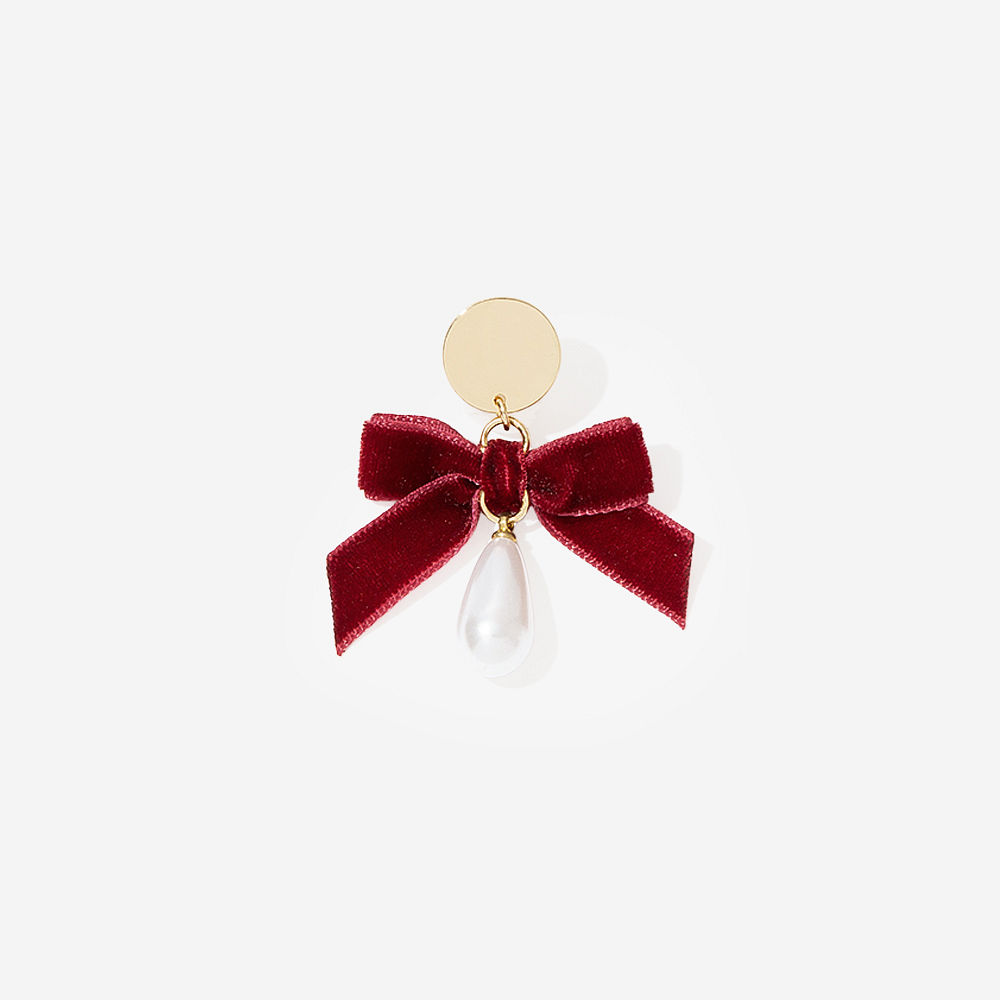 monogrammed velvet bow earrings on peyton