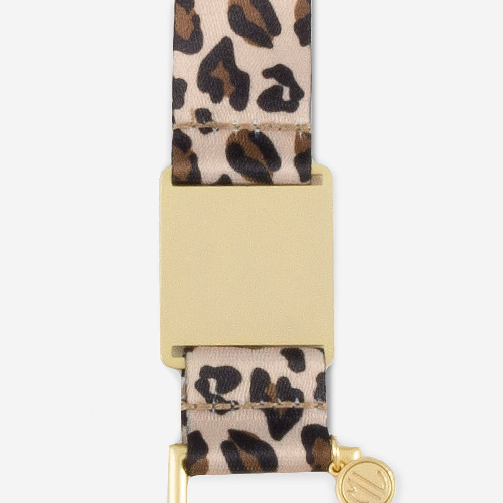 leopard breakaway lanyard on fuzzy rug