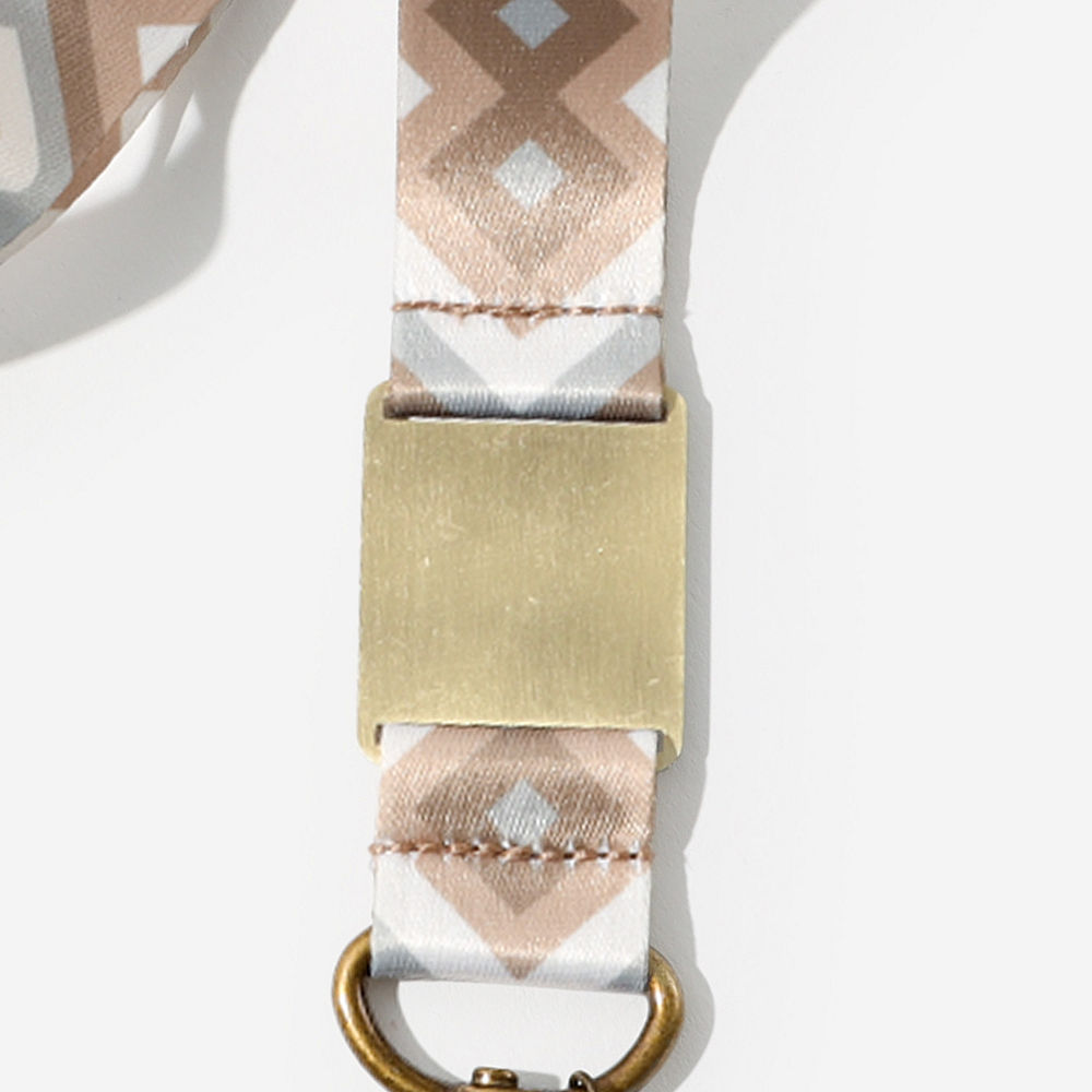 leopard breakaway lanyard on fuzzy rug