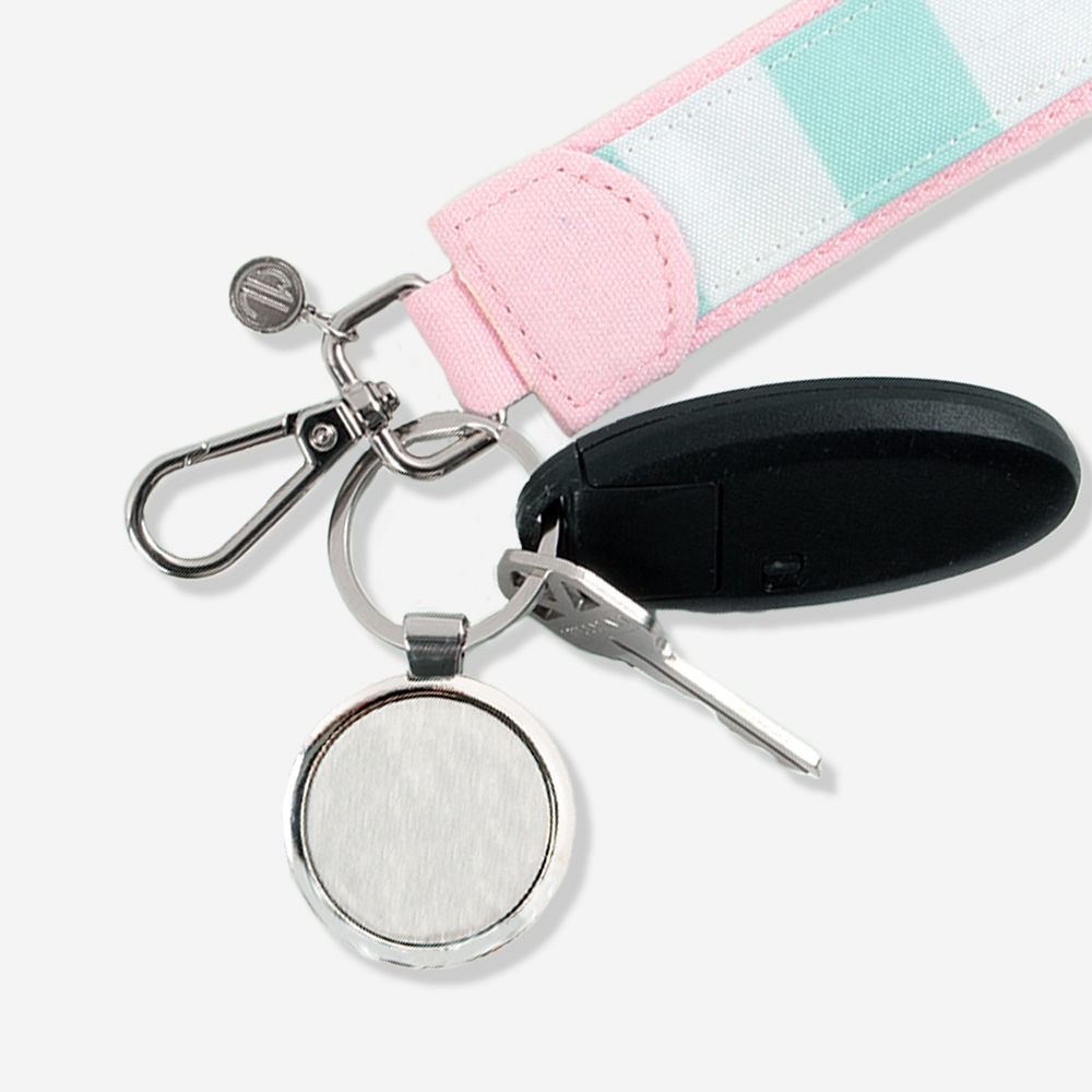 close up of cabana stripe keychain in hands