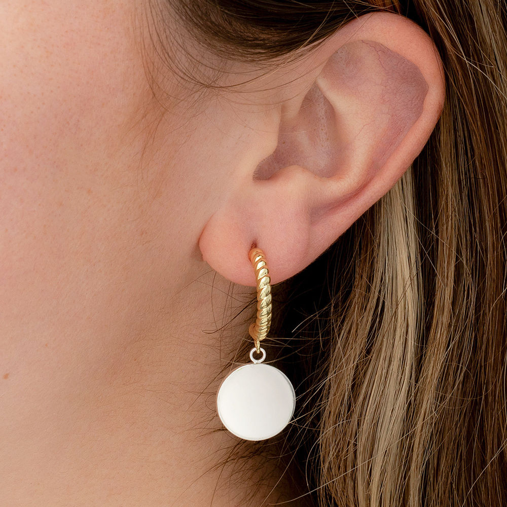 cable hoop earrings on white backdrop