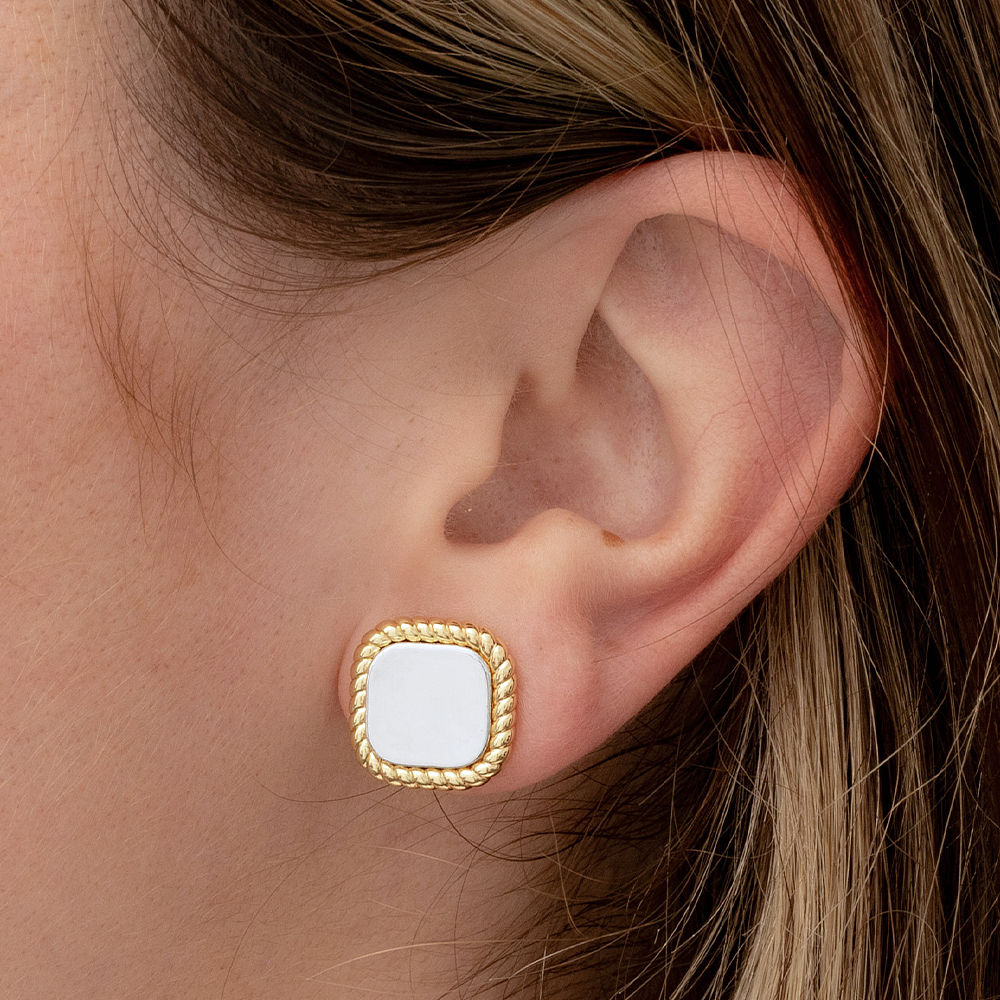 cable stud earrings in hands