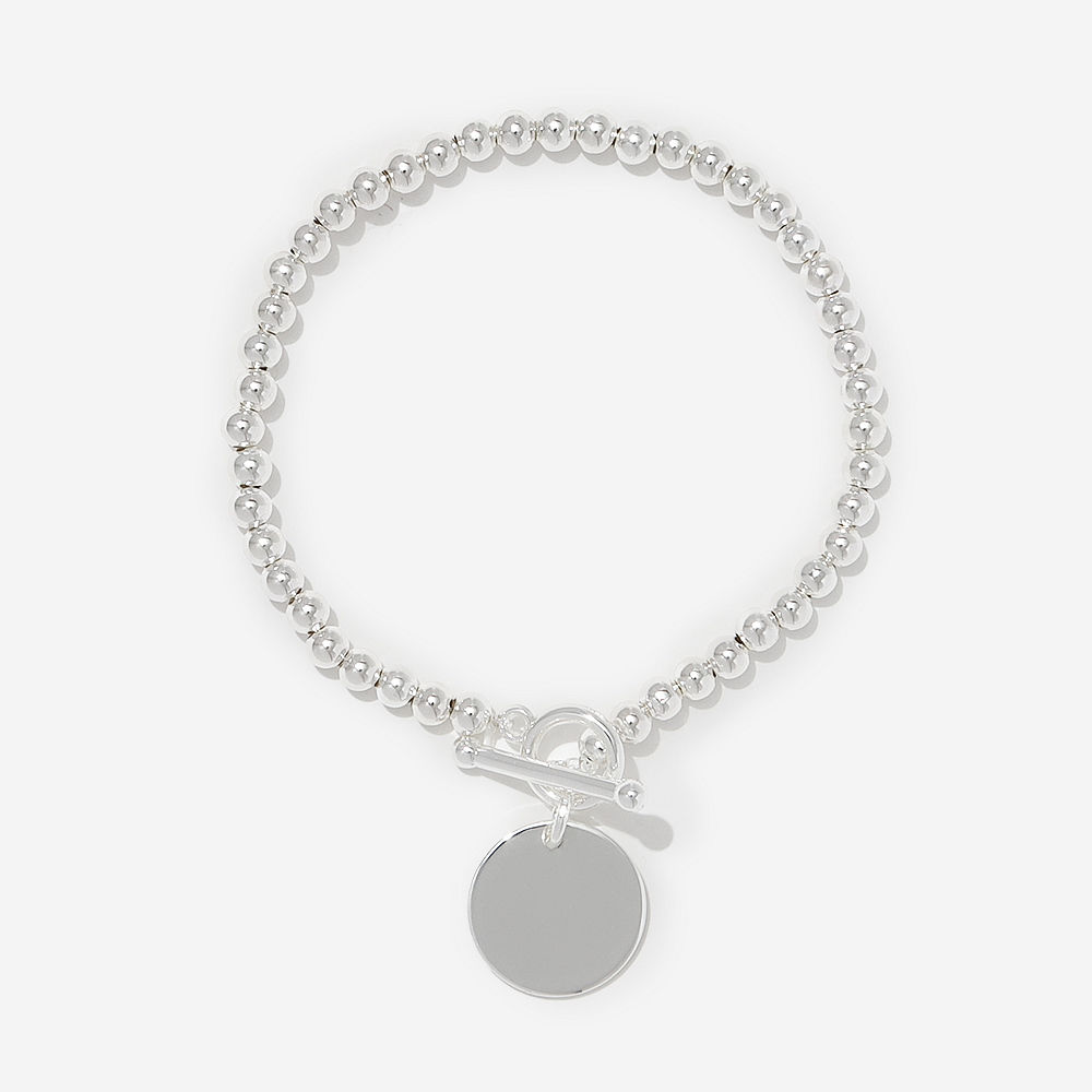 silver dainty bracelet on arm