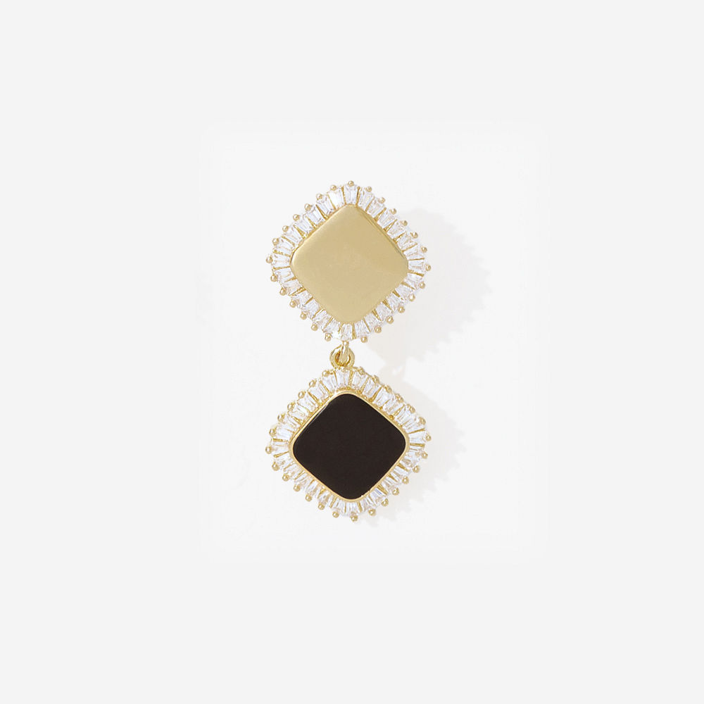 personalized gold elevated dangle earrings on marble