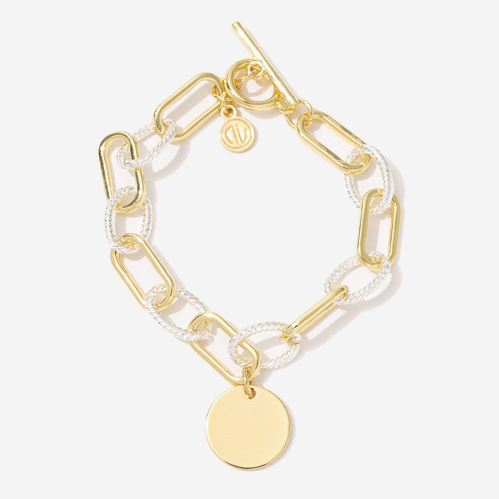 mixed metal chainlink bracelet on marble dish