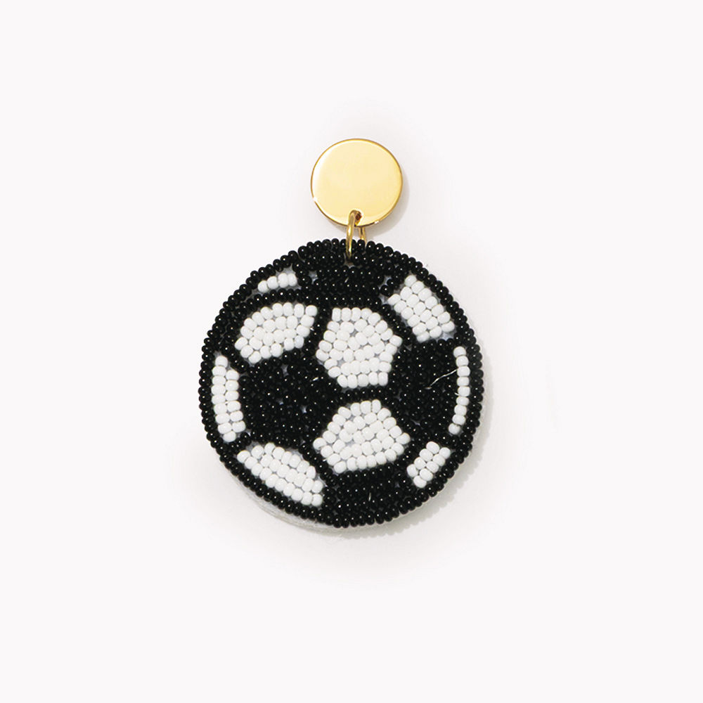 monogrammed soccer earrings on turf background