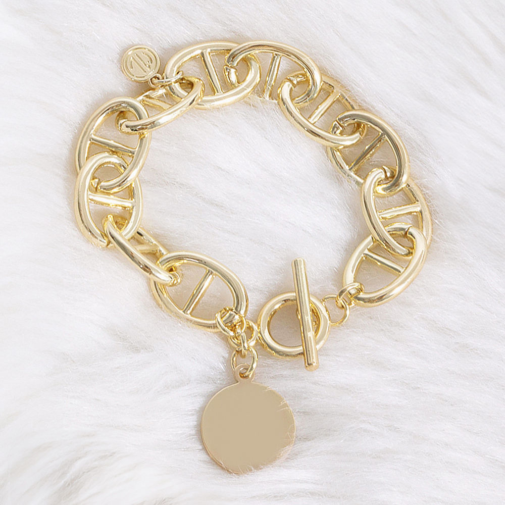 gold monogrammed link lock disc bracelet stack