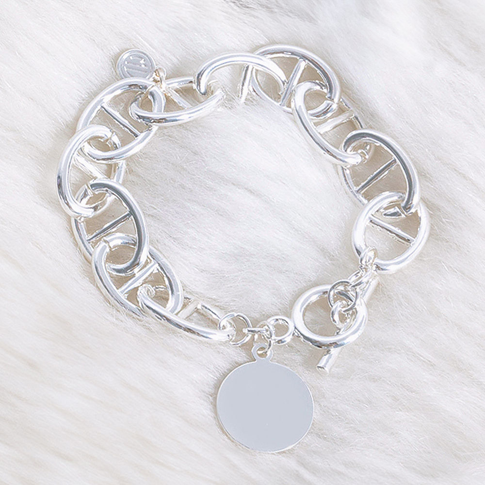 gold monogrammed link lock disc bracelet stack