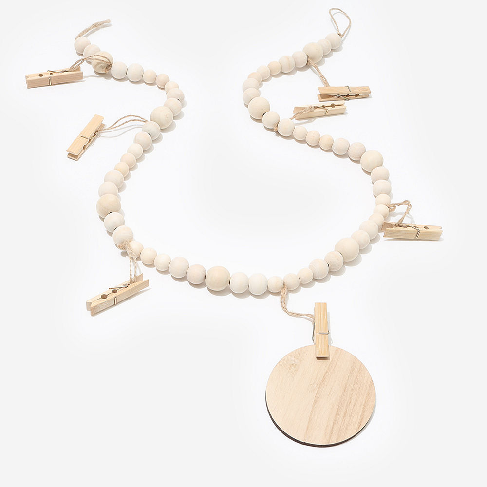 art clipped to monogrammed wooden photo garland