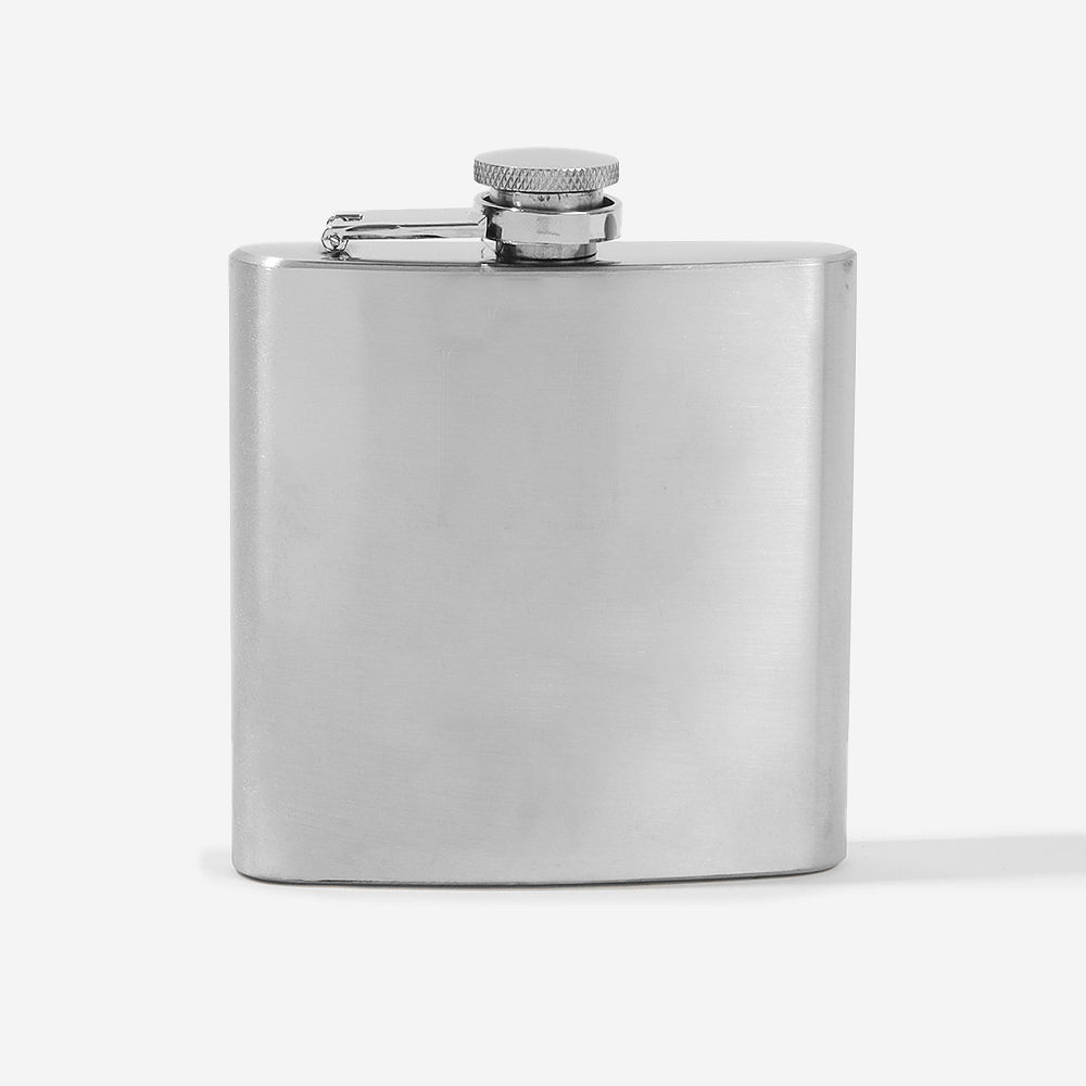 silver flask on beach vibes