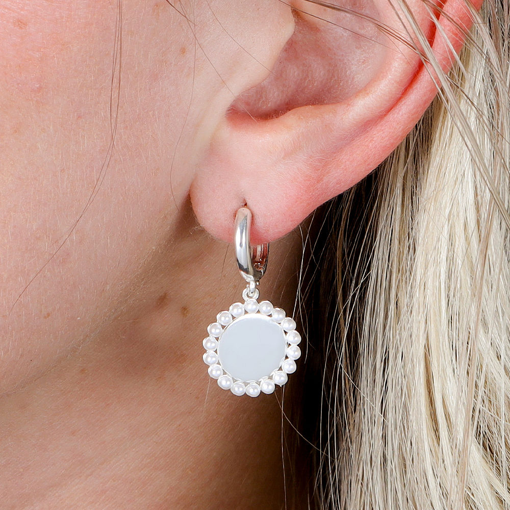 Monogrammed Huggie Hoop Earrings in Silver on marble