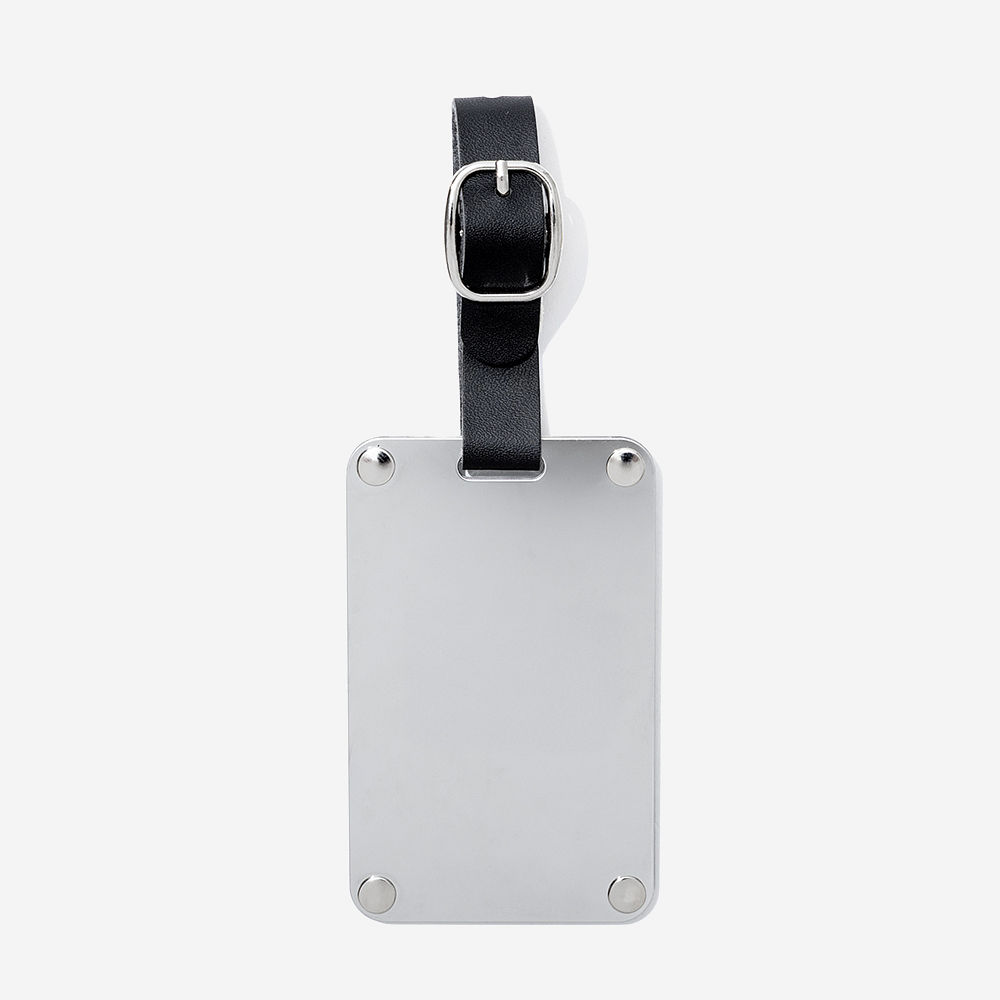 silver stainless steel luggage tag on luggage