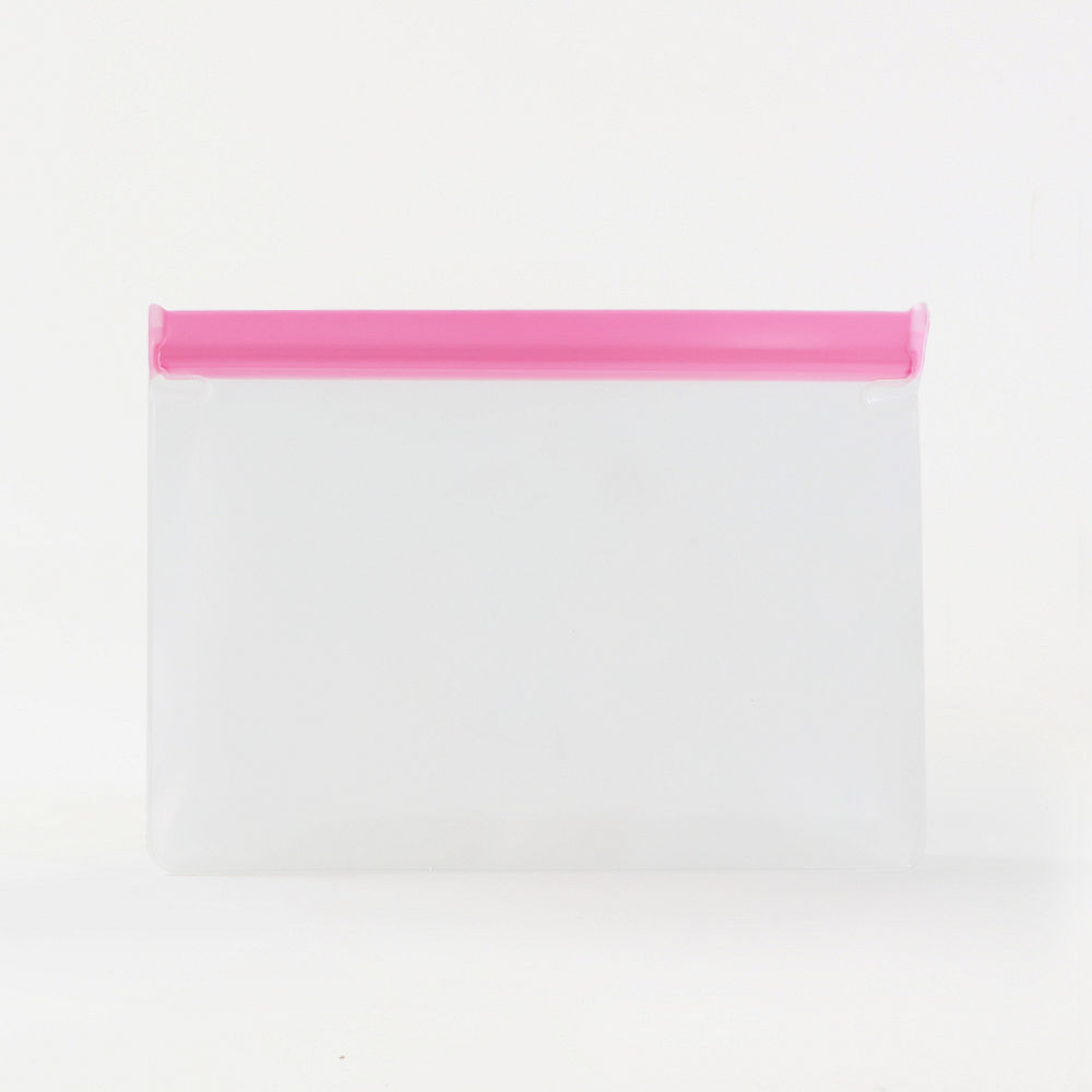 pink airtight dry bag with school supplies