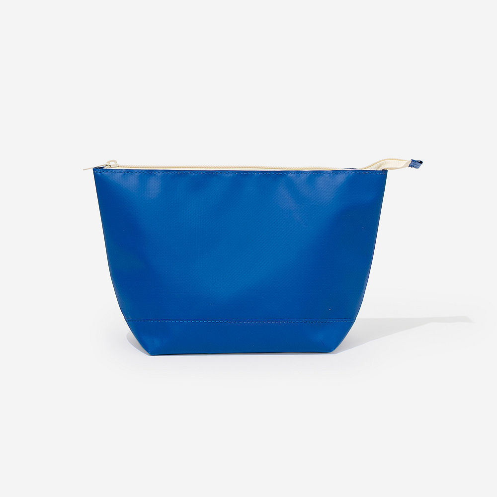 Blue waterproof cosmetic pouch on towel