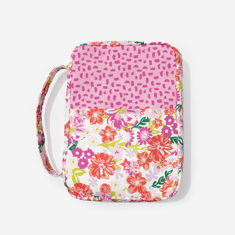 girl holding pink bible carrier