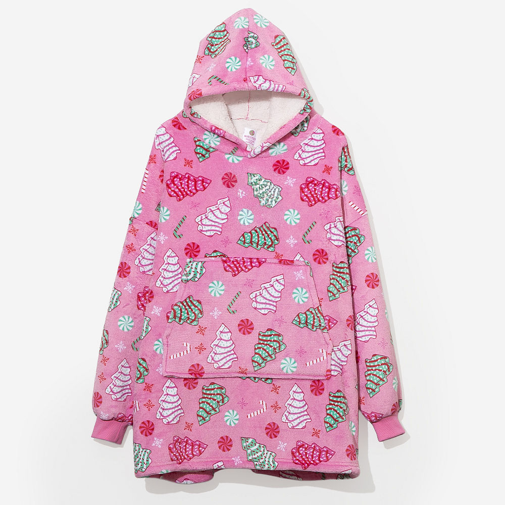 pink blanket hoodie by the fireplace
