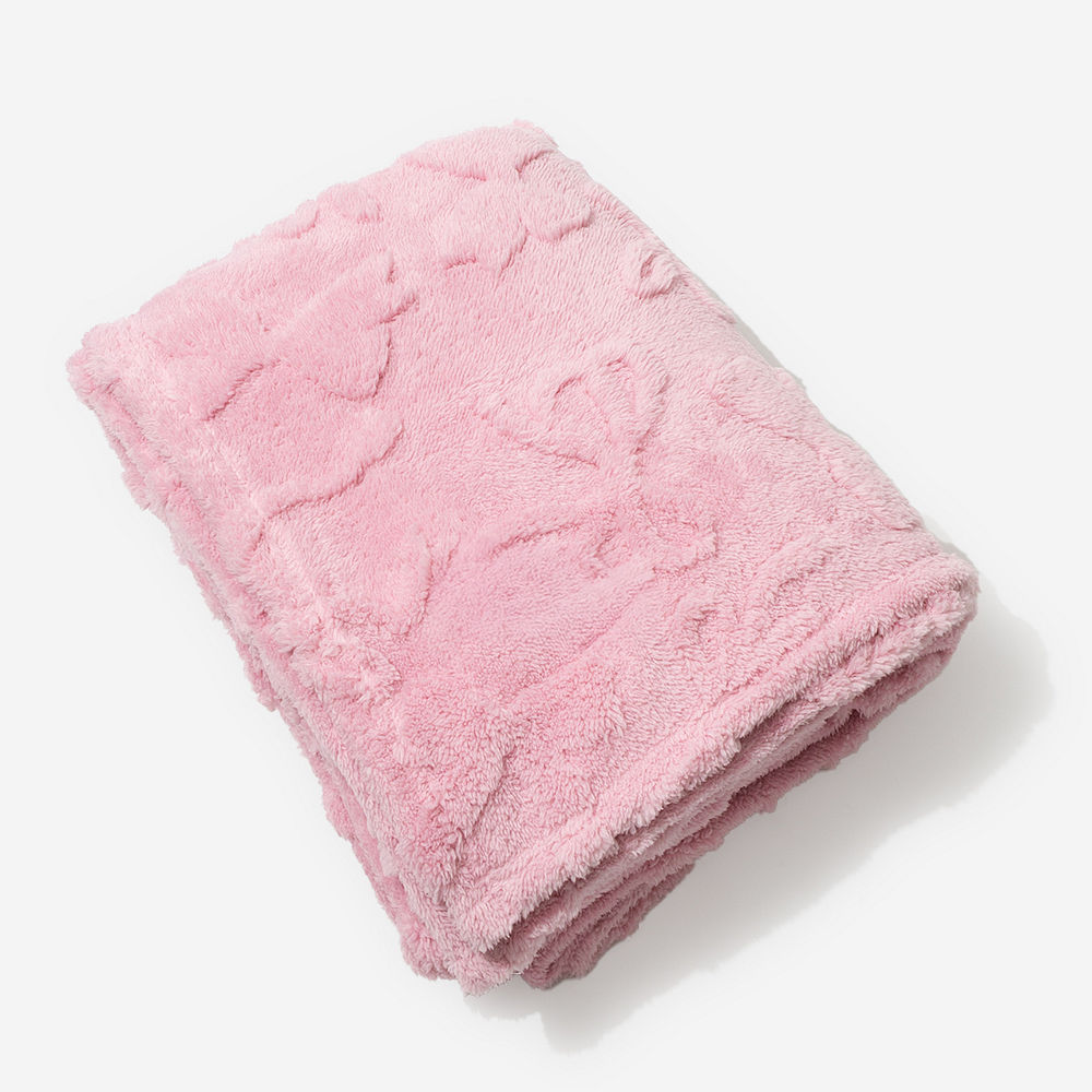 pink bow blanket on bed